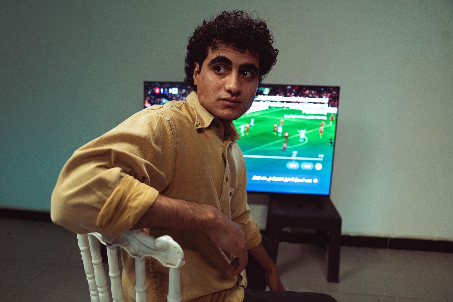 Streaming a football match on a television screen